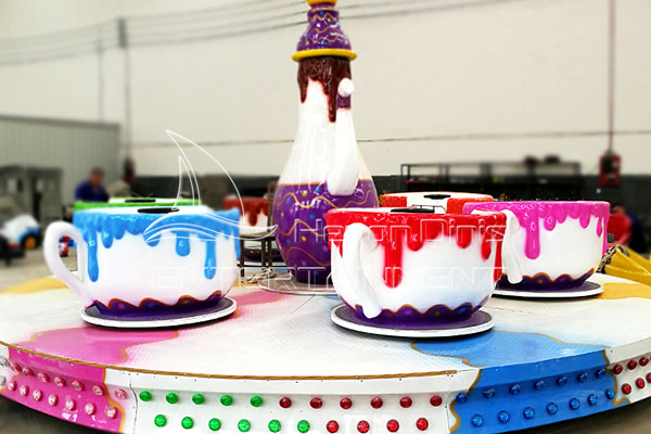 funfair spinning tea cup rides